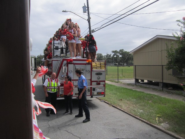 Cheerleaders on firetruck.JPG